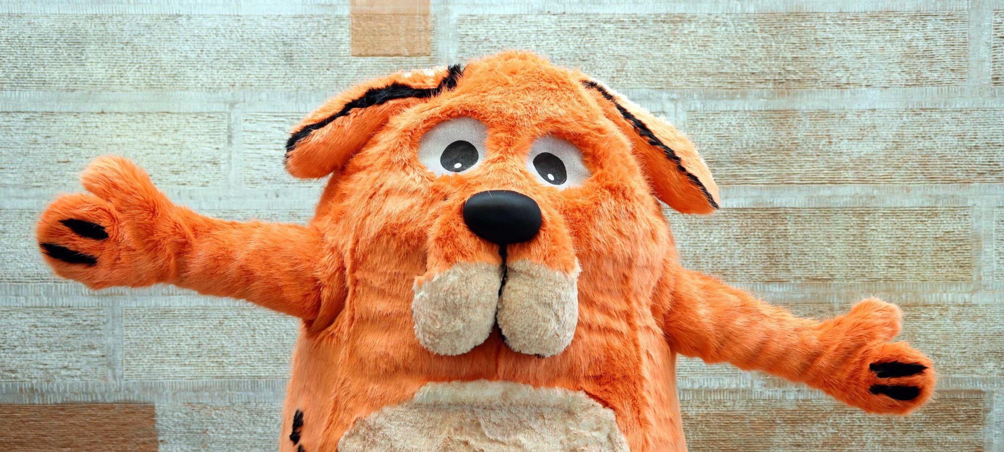 The Big Dog mascot, a large and fluffy orange dog, from the children's book festival in Dumfries.