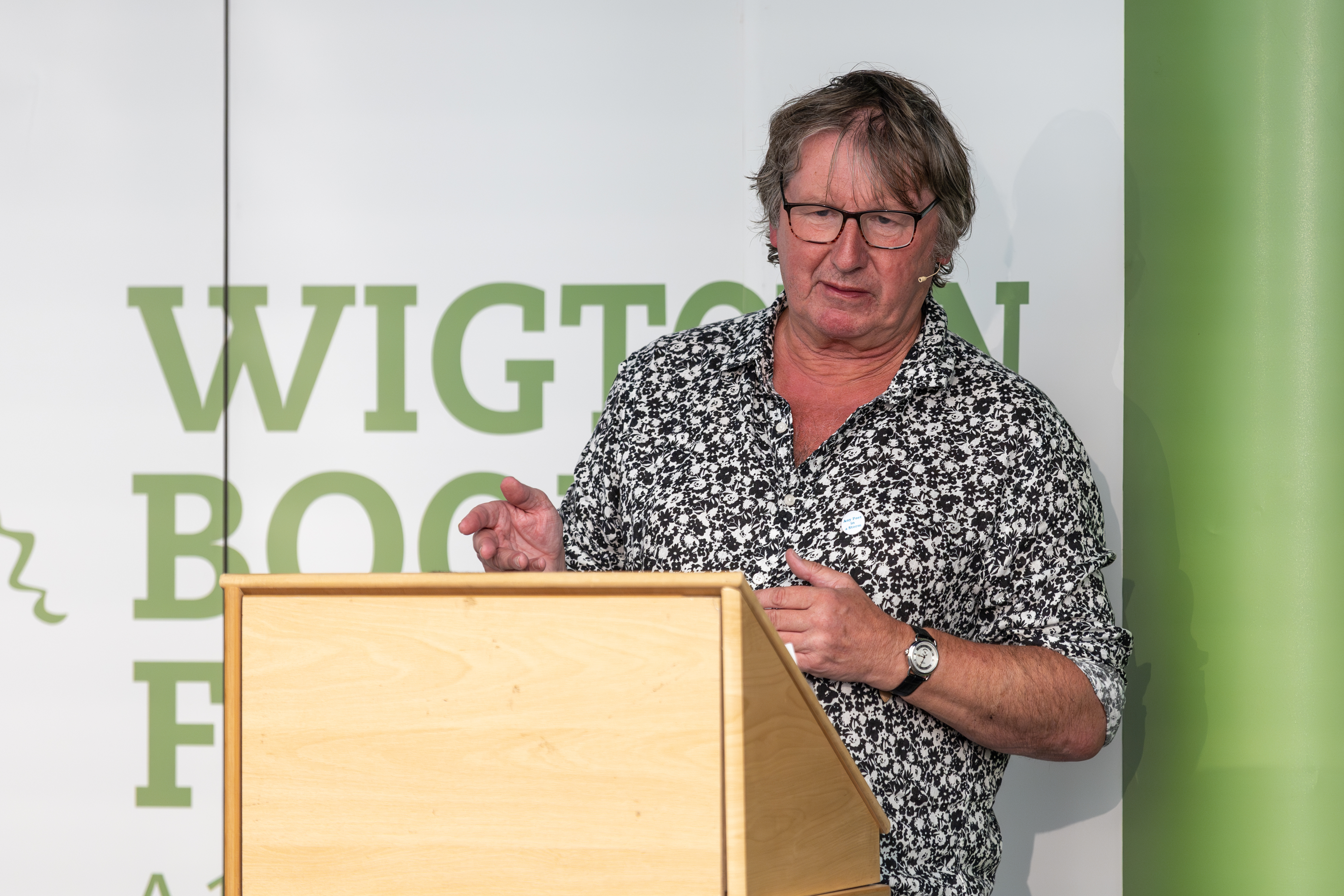 Poet Hugh McMillan on stage at Wigtown Book Festival