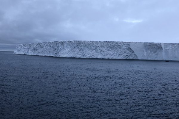 Side view of the A68 Iceburg floating in the sea.