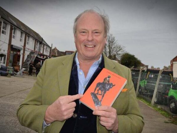 Portrait of James Braxton holding holding is new book 'Barty - a Tale of a Stolen Bronze'